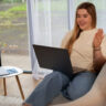 Young woman using digital mental health tools on a laptop for emotional support and online therapy.