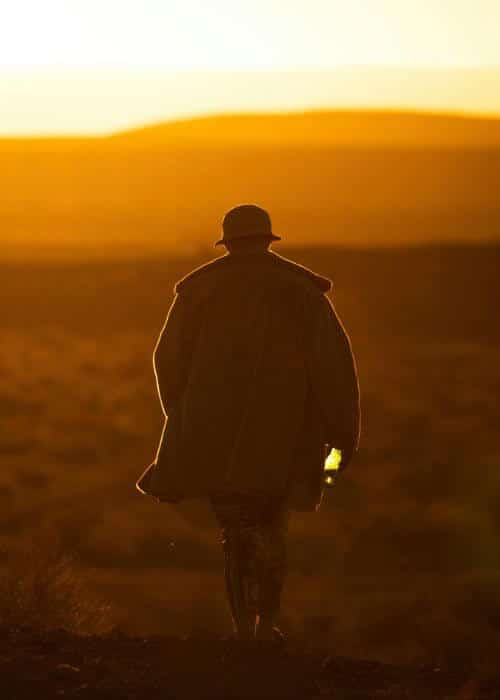 A person is walking toward the sunset, symbolizing emotional healing and the benefits of EMDR therapy.