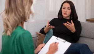 Therapist and client during EMDR therapy session focused on trauma recovery in a private Glen Ellyn office setting.